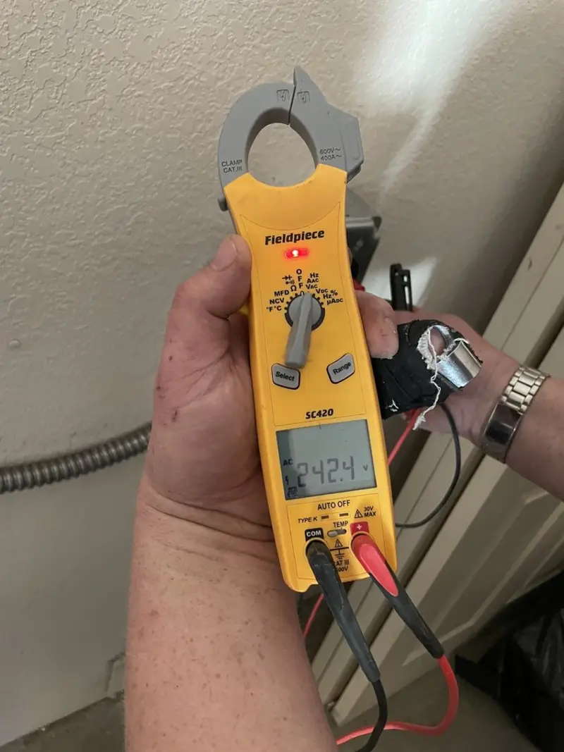 Voltage testing with clamp meter during Outlet Installation in Scottdale